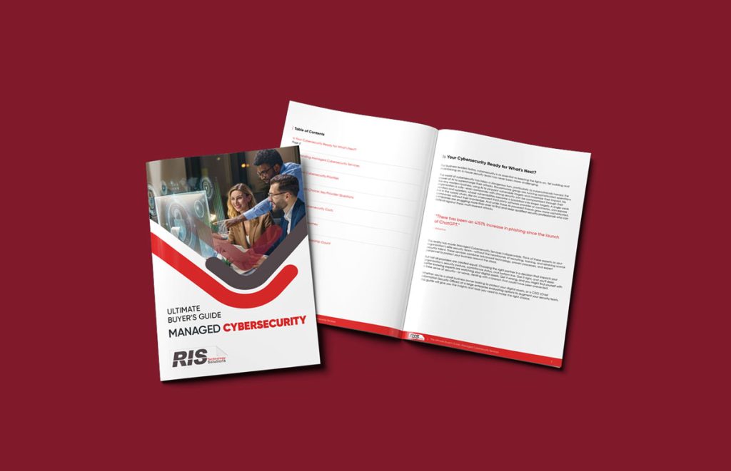 A closed and an open booklet are displayed on a maroon background. The cover reads Ultimate Buyer’s Guide: Managed Cybersecurity & Managed Print Services, with an image of professionals at computers. The open booklet shows text and a table of contents.