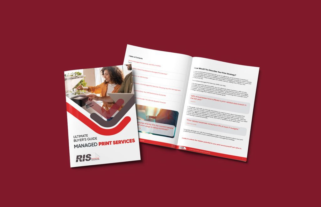 A closed and open copy of the “Ultimate Buyer’s Guide: Managed Print Services” booklet is displayed on a red background. The cover features a woman using a printer, bold red and black text, and highlights the essentials of Managed Print Services inside.